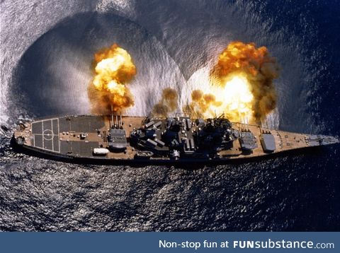 The USS Iowa (BB-61) fires her 16-inch/50 caliber guns