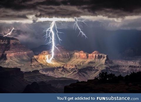 Grand Canyon getting lit only by a lightning stroke