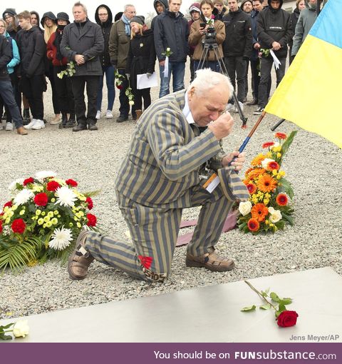 Former Nazi concentration camp survivor observes moment of silence at commemoration
