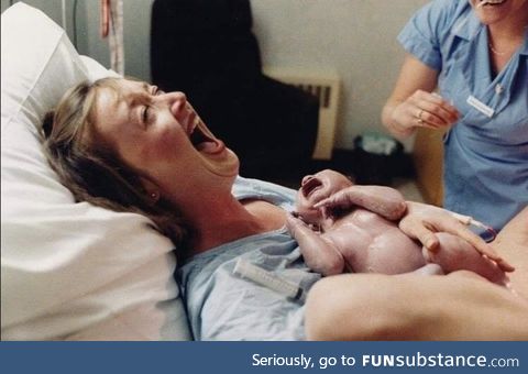 Moments after giving birth a mother laughs hysterically at her husband who just fainted