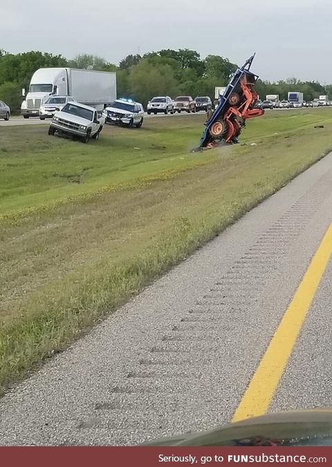 All I can say is someone sure can strap down a tractor!