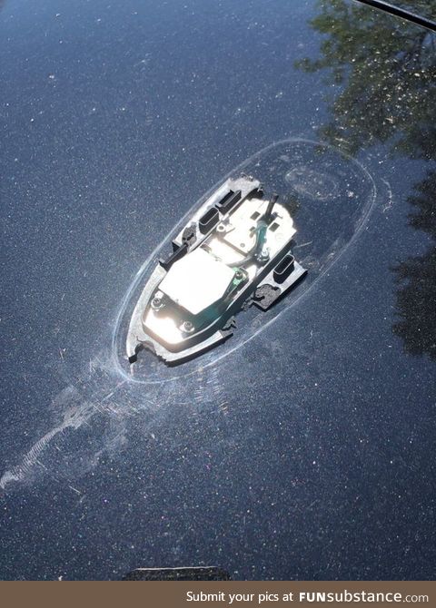 A broken car antenna that looks like a sunken boat
