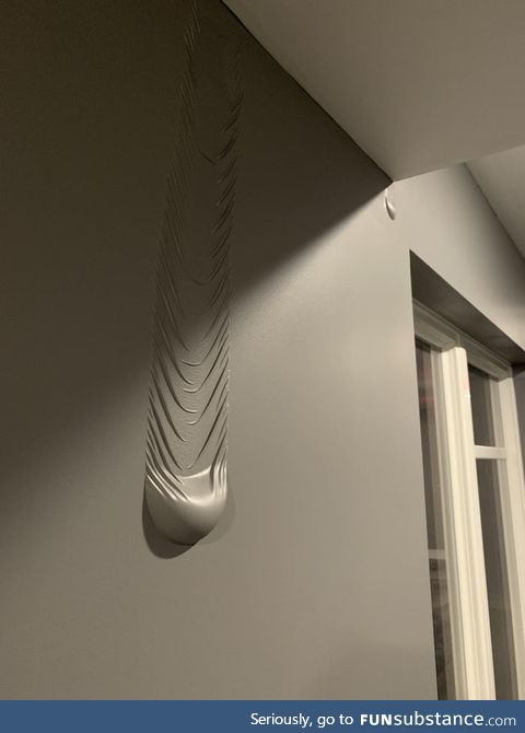 This water leaking between the wall and paint