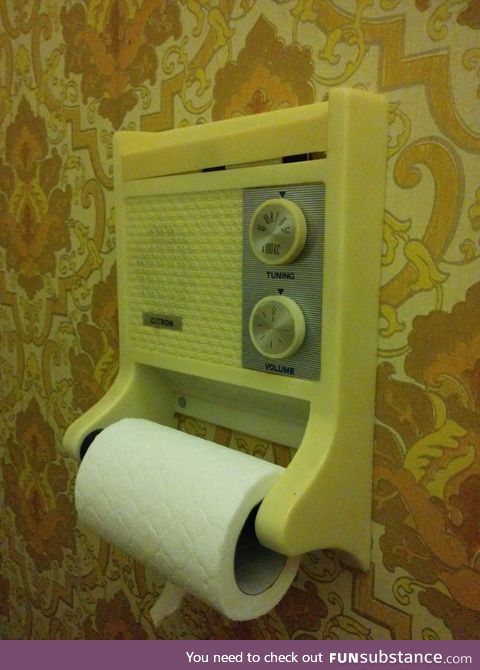 A toilet roll holder with a radio