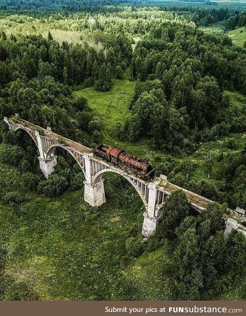 This abandoned railroad track with train still on it