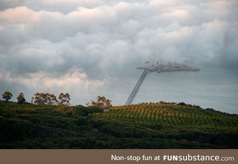 Man-made island in the fog