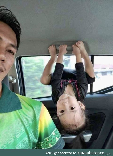 This little girl doing her best Batgirl impression with her dad