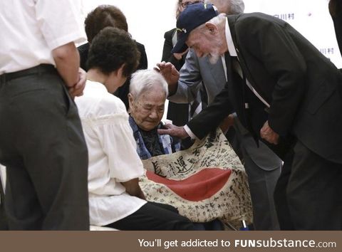 US marine returning a flag to a fallen Japanese soldier’s family. This is the only