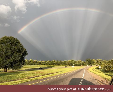 Interesting rainbow with sun rays
