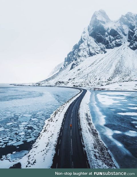 The frozen waters surrounding the road