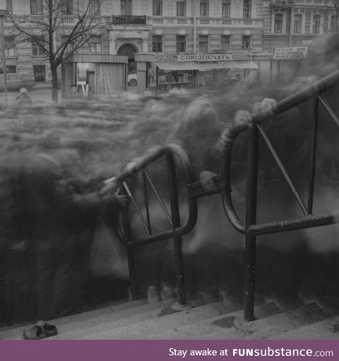 Long exposure of a crowd trying to enter Vasileostrovskaya subway station in Saint