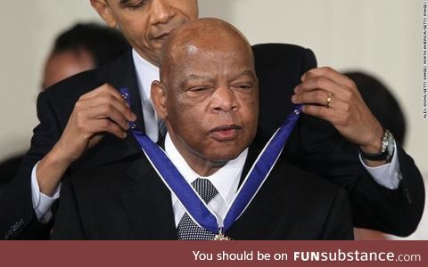 Barack Obama awarding the presidential medal of freedom to the late representative John