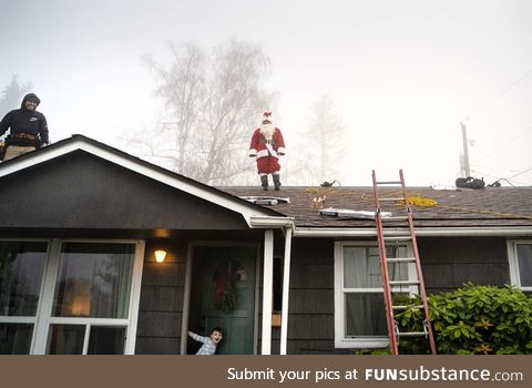 One of the roofers decided to dress up as Santa while installing our roof, today. My son