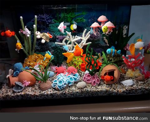 Incredibly detailed aquarium featuring underwater creatures all made out of crocheted yarn