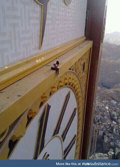 A Woman Sitting On The Abraj Al-Bait, circa Mecca