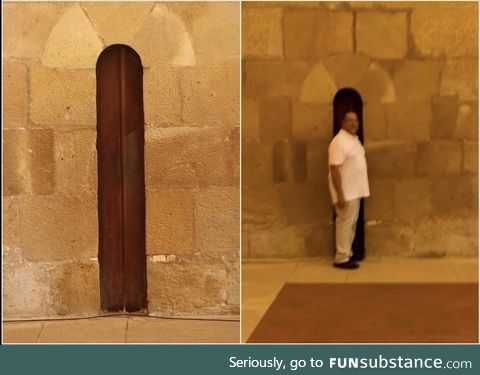 The door to the dining area of the Alcobaça Monastery in Portugal was made narrow so