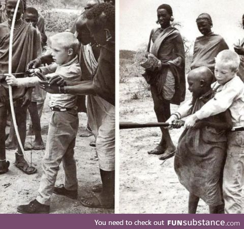 Two boys teaching each other parts of their culture . Photography credit: Robert Halmi