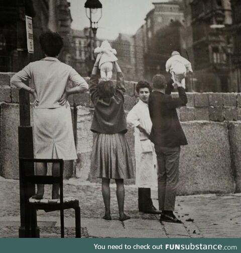 Residents of West Berlin checking for snipers, 1961