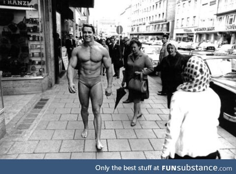 Arnold Schwarzenegger walking through Munich to promote his gym (1967)