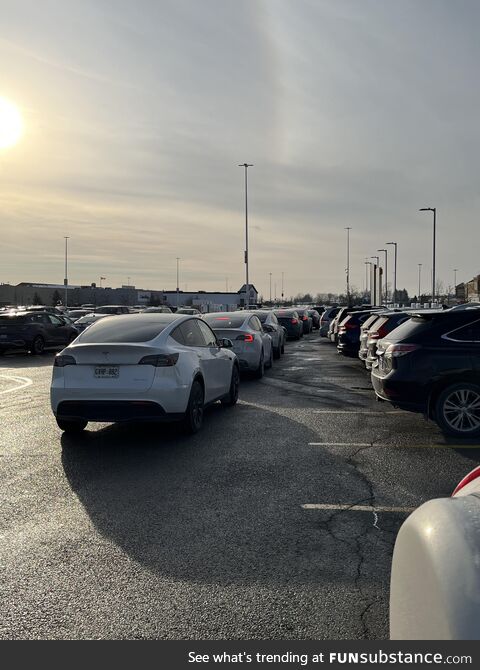 Lineup of Teslas waiting for a charging station, Vaughan Mills Ontario (Original post was