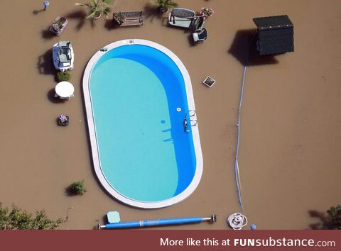 Swimming pool untouched by flood water