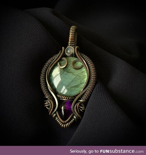 I handmade this Giger inspired necklace with copper wire and semi-precious stones