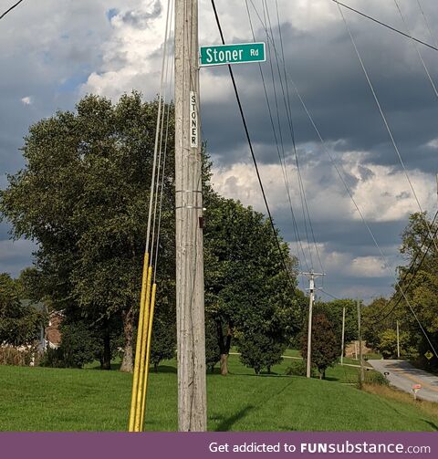 This street sign has been stolen a countless number of times. It keeps getting higher,