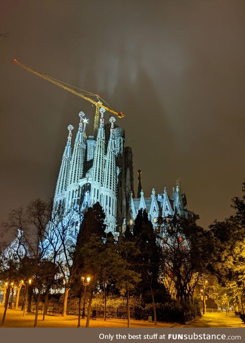La Sagrada Familia casting a shadow on the clouds above