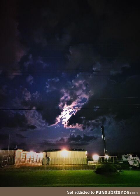 Moon silhouetted through clouds. Ontario, canada
