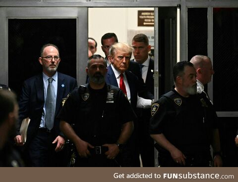 Donald Trump on his way to the courtroom