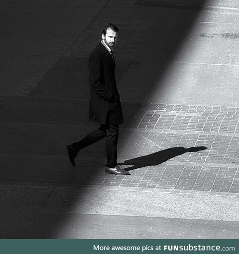 A man walking into the light