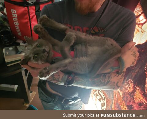 She loves being held like a baby but insists on stretching this way