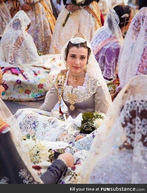 Women in the floral procession to the virgin of the helpless (Spain)