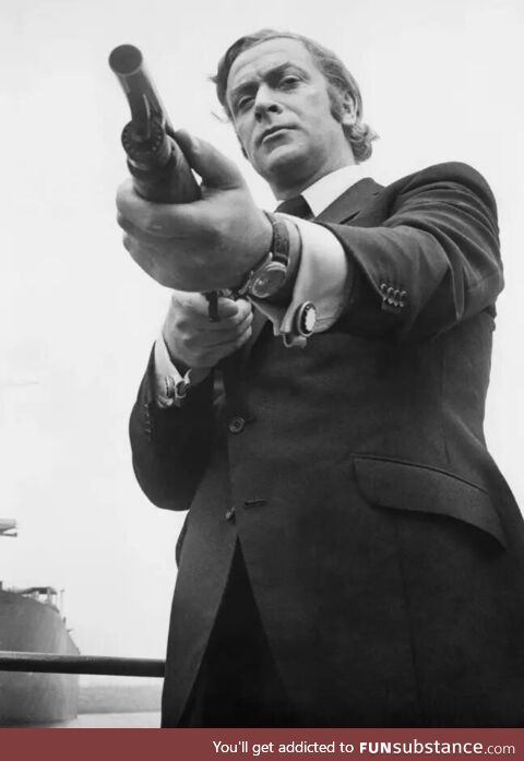 Michael Caine pointing Ithaca 37 (Promotional Photo for “Get Carter”)