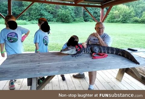 Our Cub Scouts met a man with an emotional support alligator named Wally