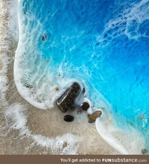 Ocean artwork made with resin, rocks and sand