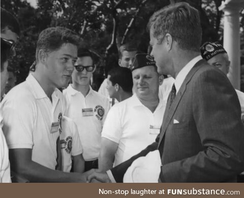 John Kennedy shaking hands with future president Bill Clinton, 1963