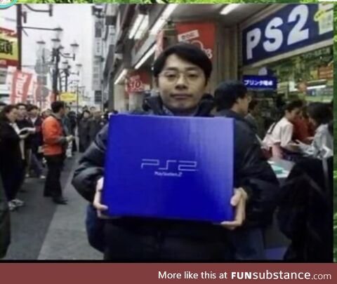 A Japanese man holding his newly acquired PS2 in the launching day in Japan. March 4 2000