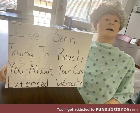 Nurses having a little fun with elderly training dummy at local rehab facility