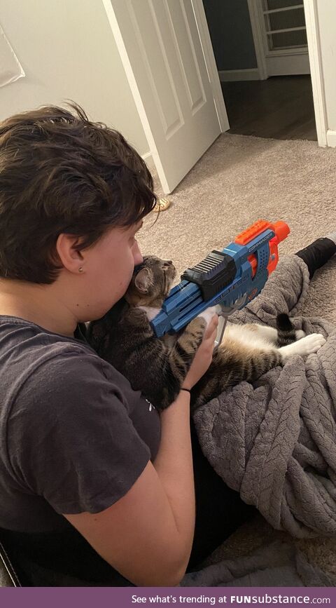 Gf teaching cat how to shoot