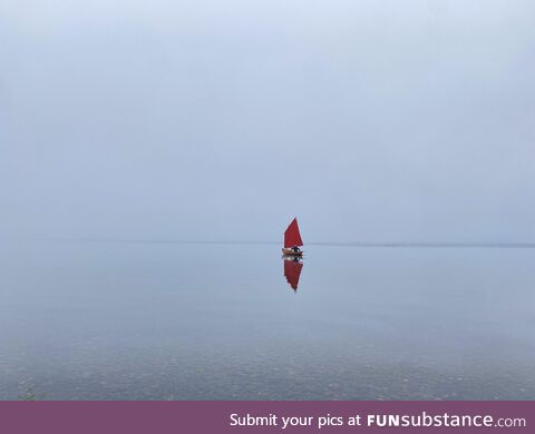 Sailing into the dawn mist on Lake Toya, Japan