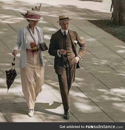 A couple walking on the streets of New York on a spring day in 1915