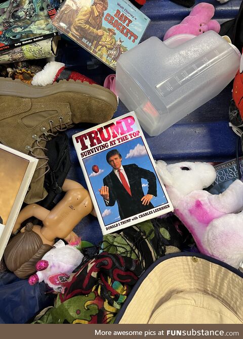 Trump's book "Surviving at the Top" at the bottom of a goodwill outlet bin