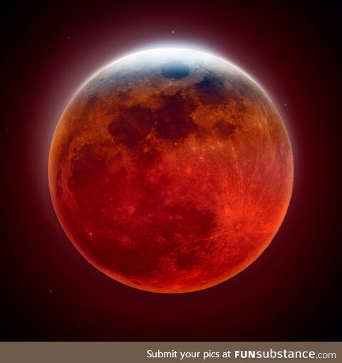 A shot from this morning's total lunar eclipse. This image was captured by using two