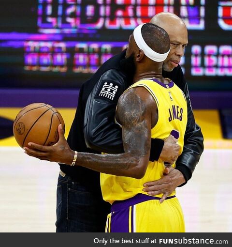 Former Lakers player Kareem Abdul-Jabbar congratulates LeBron James on a historic night