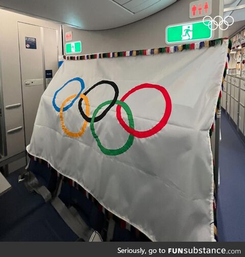 The Olympic flag is in flight, officially on its way to Los Angeles