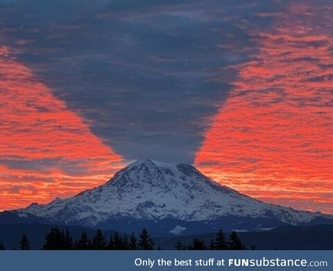 Mount Rainier casting a shadow on the morning sky