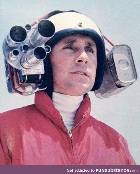 Formula one Champion Jackie Stewart wearing an early helmet camera to capture onboard