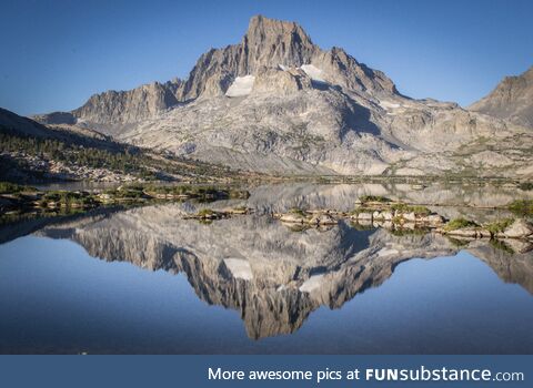 An exceptionally calm morning at 10,000ft left the lake almost still as glass