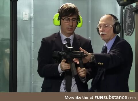 A safety inspector checking if a gun can survive John Oliver hotness